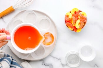 peach whiskey jello poured into shot glasses.