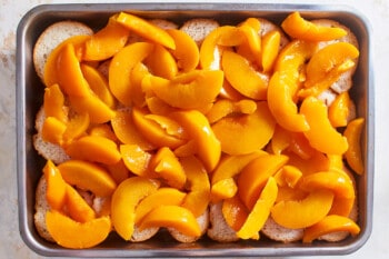 baking dish filled with bread and peaches