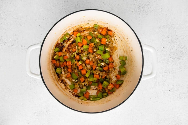 carrot onion and celery with roux in a dutch oven.