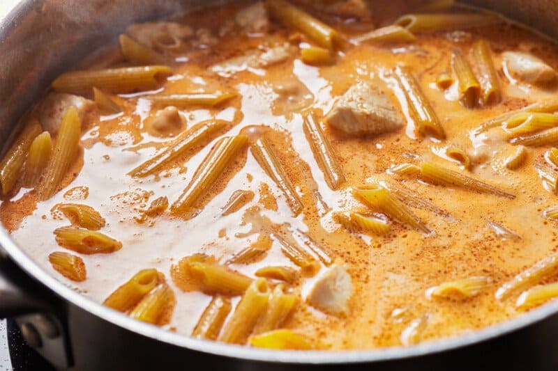 penne and chicken submerged in creamy alfredo sauce