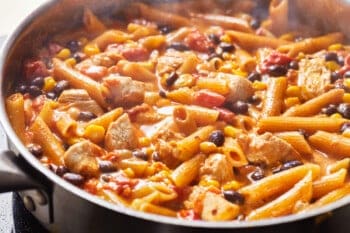 skillet of penne pasta with chicken
