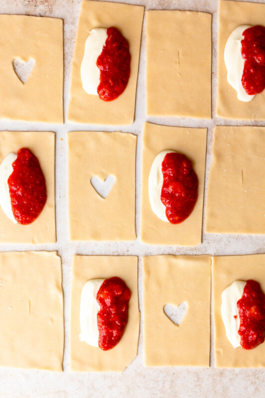 pie crust cut into 12 rectangles, some with strawberry cream cheese filling