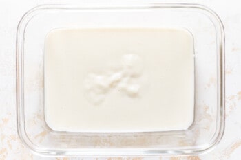 glass casserole dish filled with milk mixture