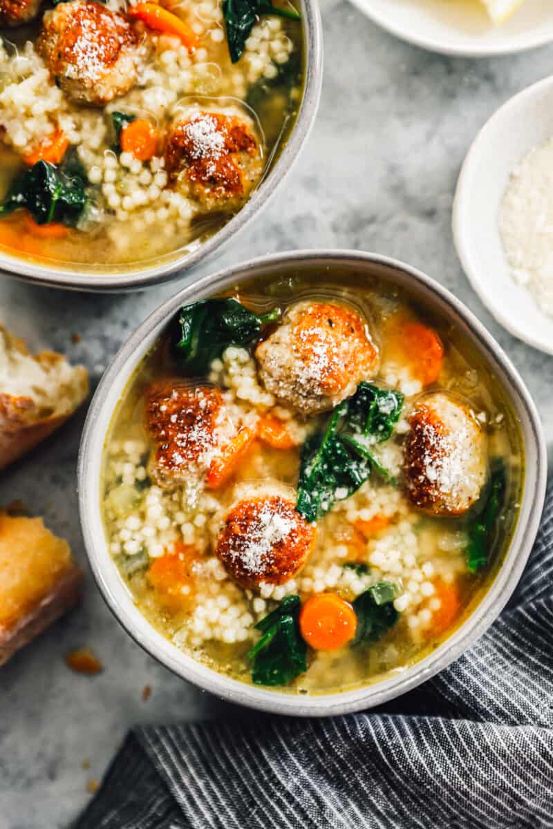bowls of italian wedding soup with meatballs