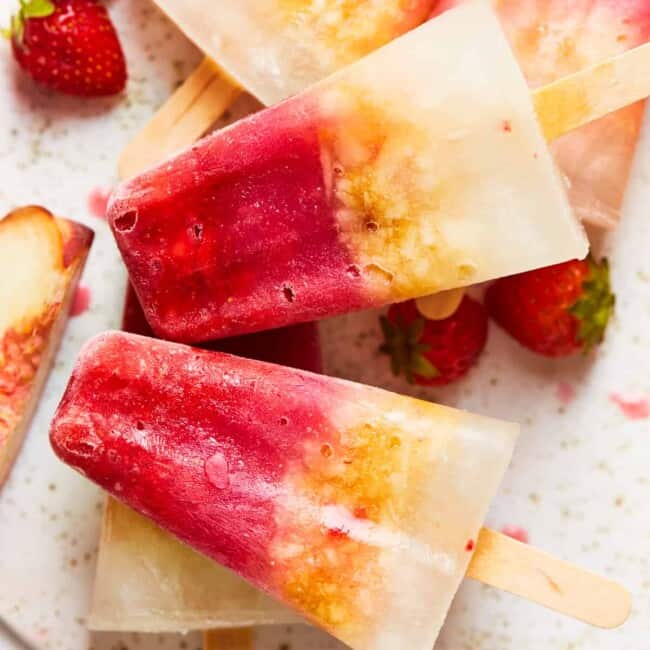 margarita popsicles stacked up on a board