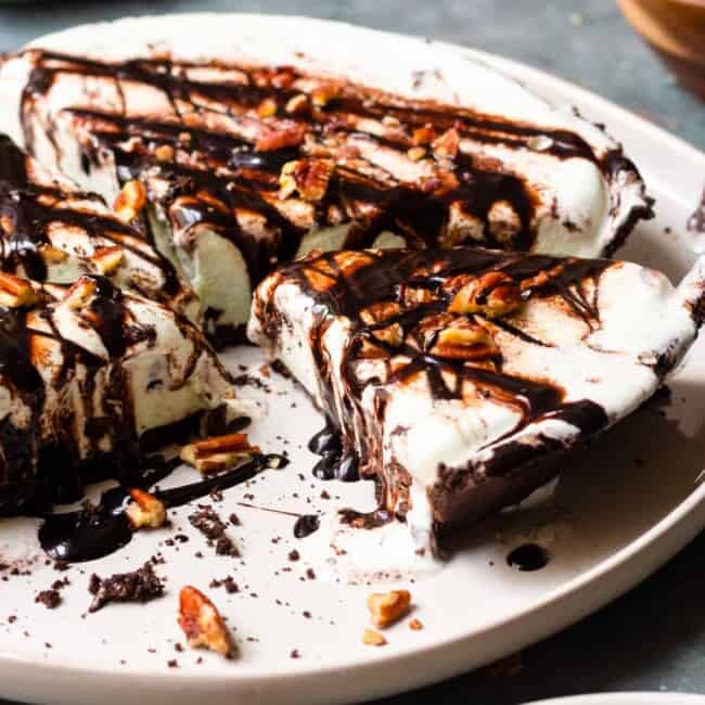 mint chocolate chop ice cream pie on a plate with sliced taken away
