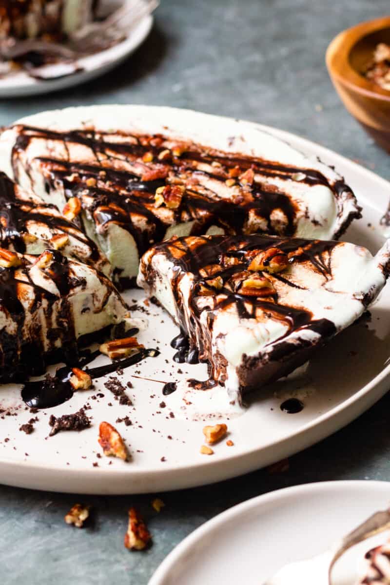 mint chocolate chop ice cream pie on a plate with sliced taken away