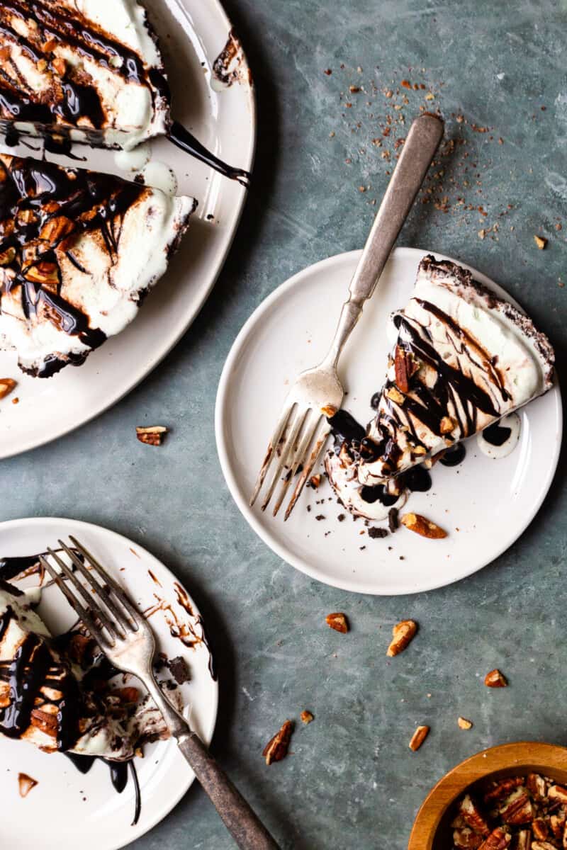 pieces of mint chocolate ice cream pie on plates with forks