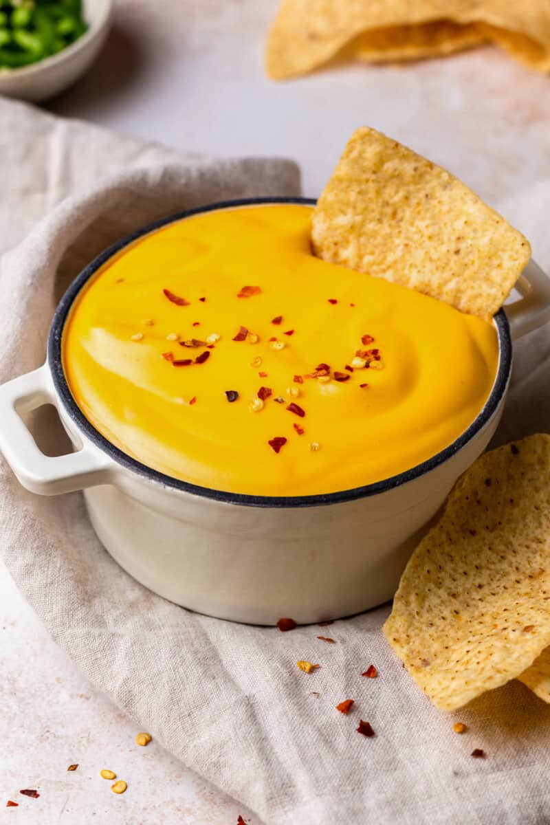 bowl of cheese sauce with tortilla chips
