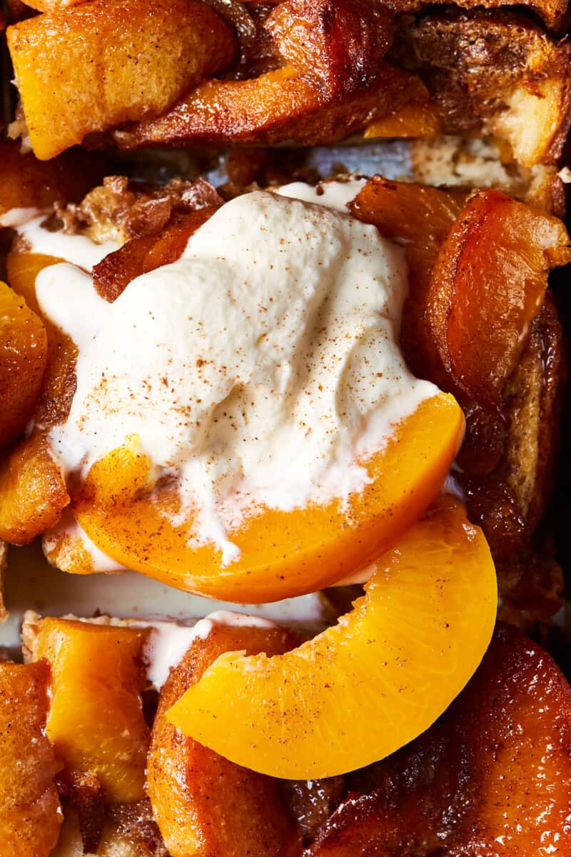 close up on french toast topped with peaches and cream