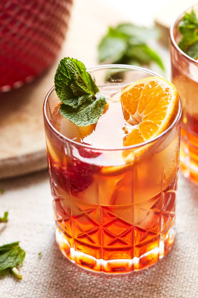 a glass of spiked iced raspberry sweet tea