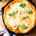 cast iron skillet pizza on a tablescape