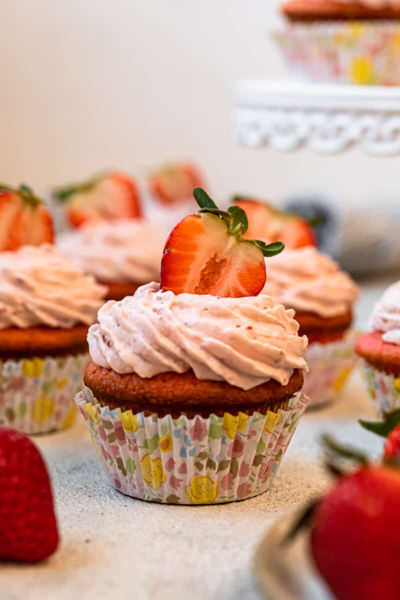 strawberry cupcakes in colorful cupcake wrappers.