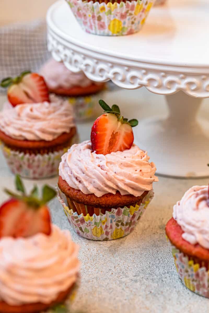 strawberry cupcakes in colorful cupcake wrappers.
