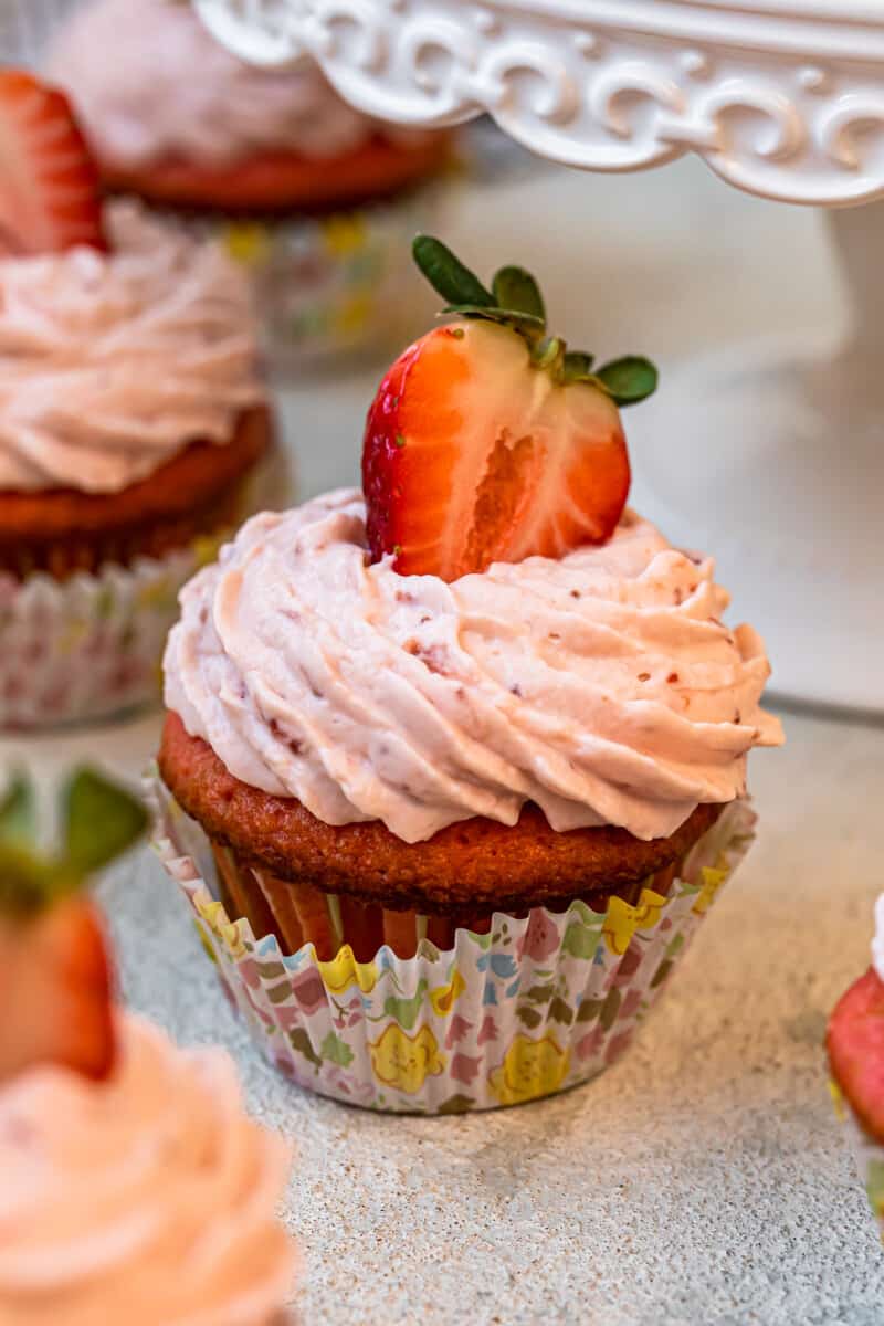strawberry cupcake in a colorful cupcake wrapper.