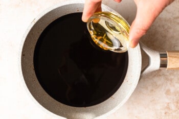 pouring honey into balsamic reduction
