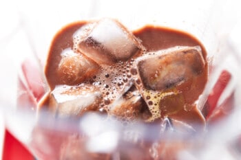 blending hot chocolate with ice in a blender