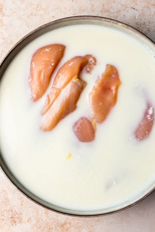 raw chicken breast soaking in buttermilk