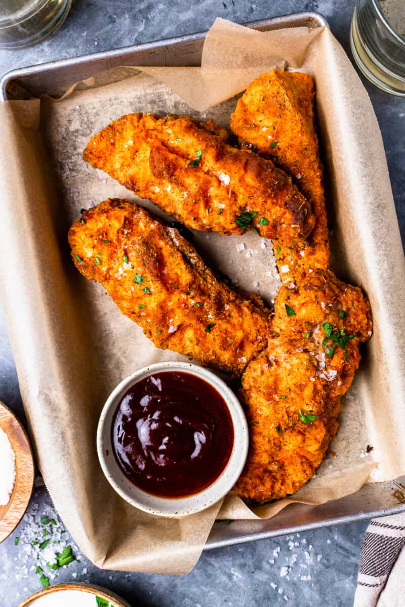 pieces of breaded and baked chicken breast with dipping sauce
