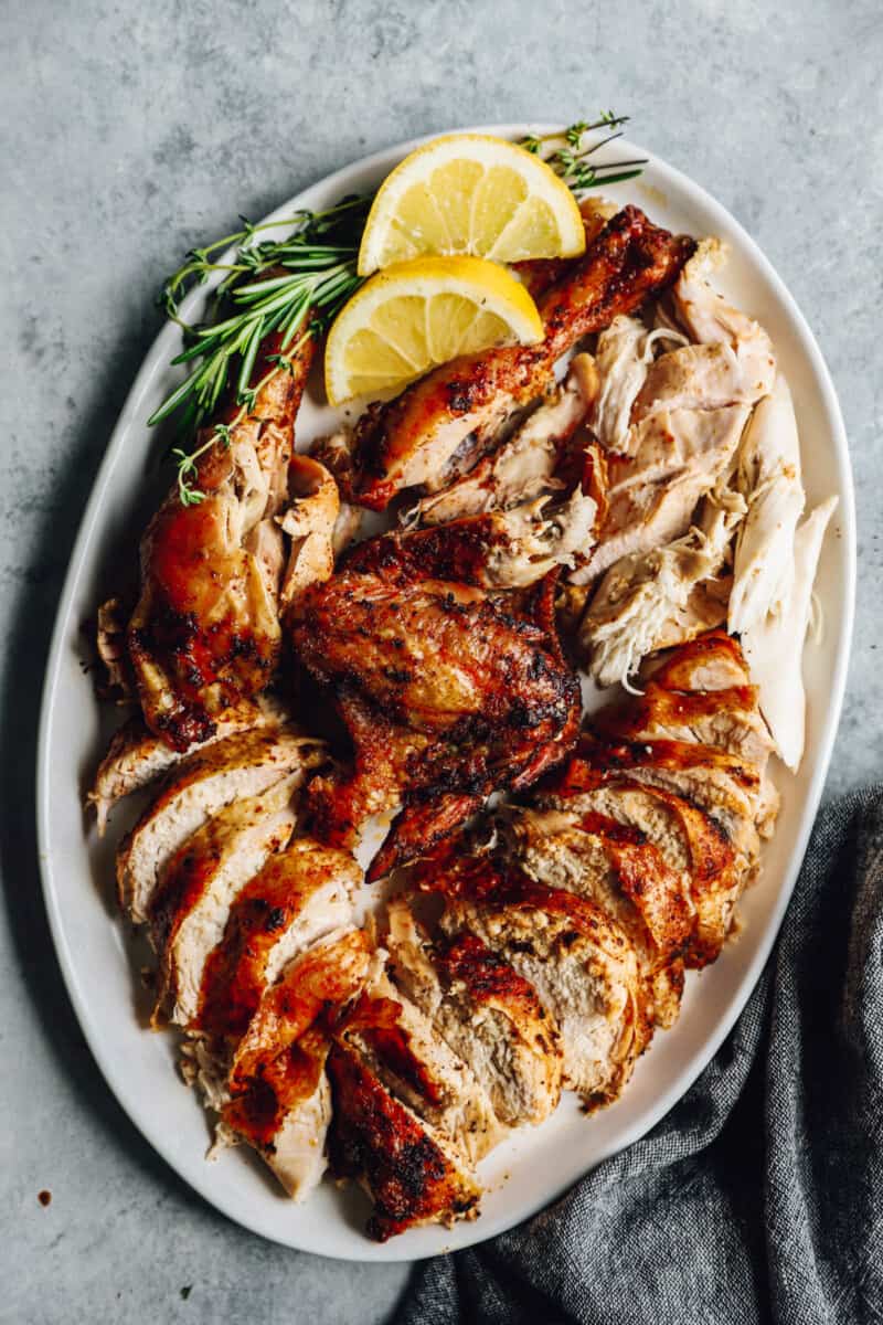 large serving platter filled with chicken cut and pulled into pieces