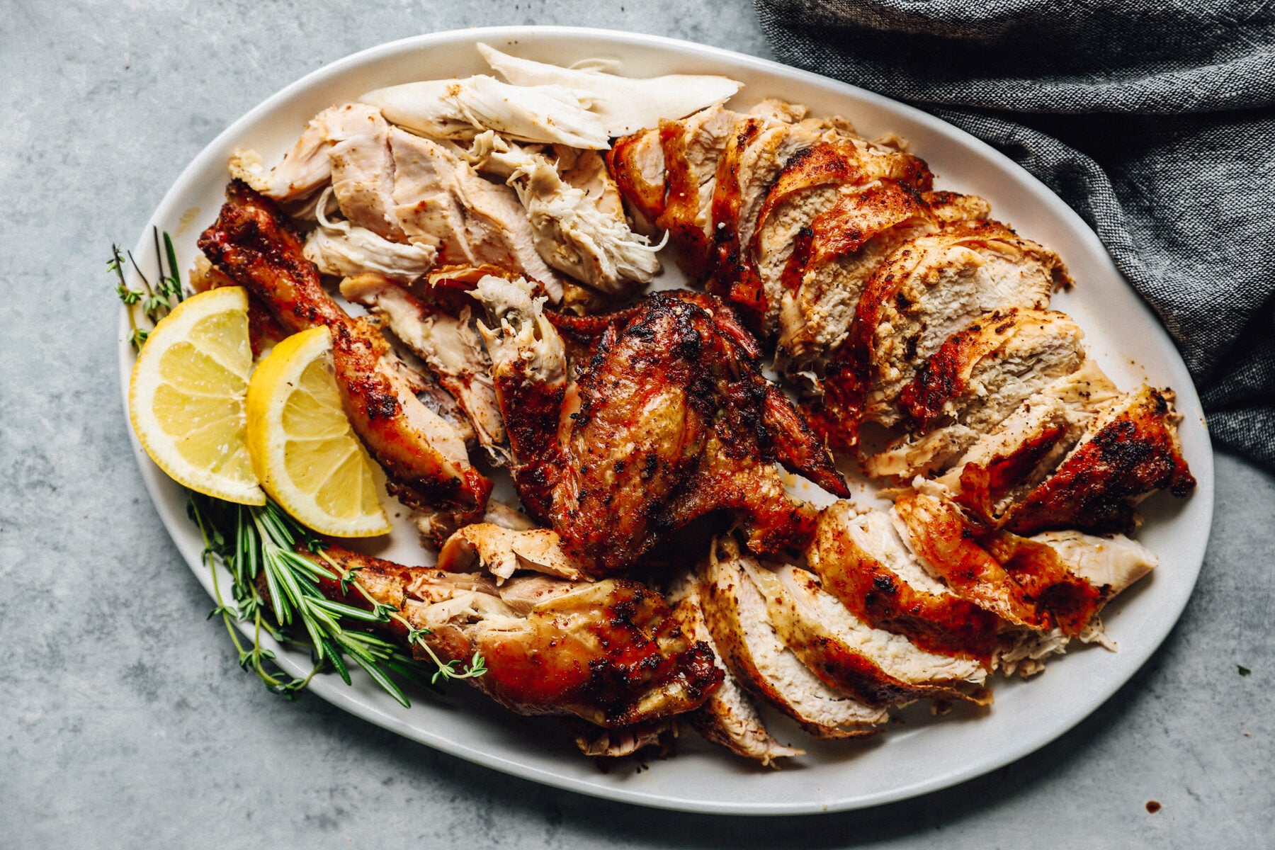 large serving platter filled with chicken cut and pulled into pieces