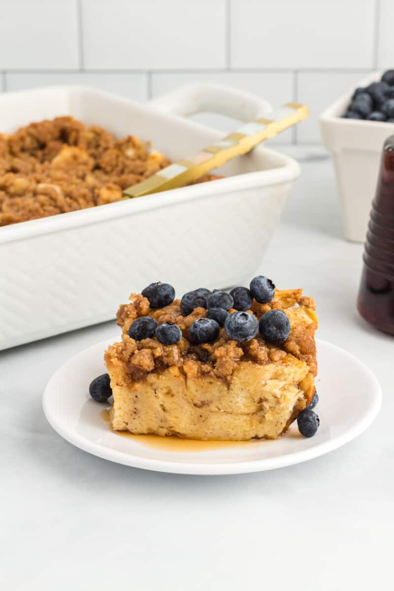 a piece of French toast casserole topped with blueberries
