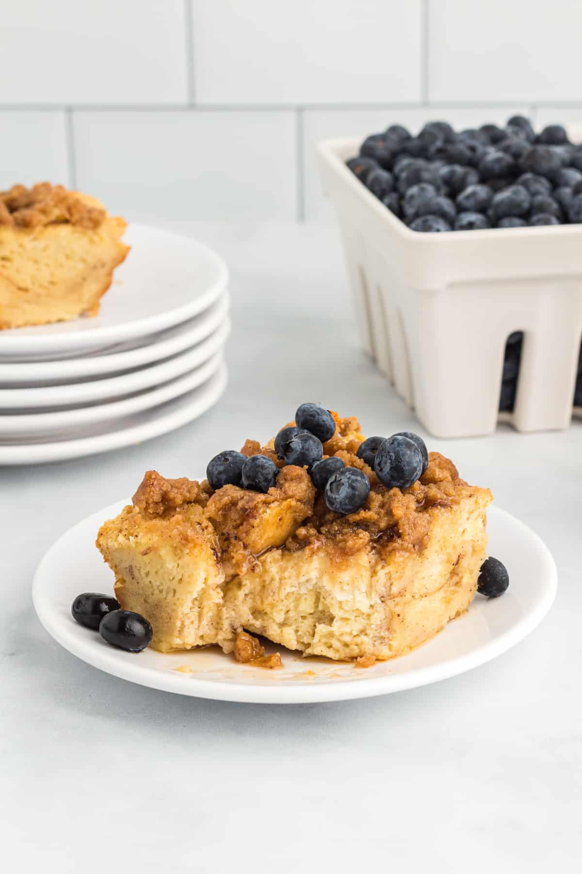 a slice of blueberry French toast casserole on a plate