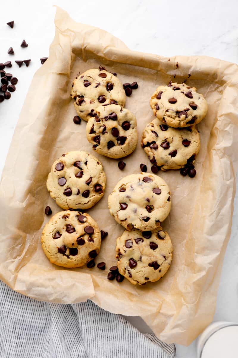 caramel stuffed cookies on a baking sheet covered in parchment paper