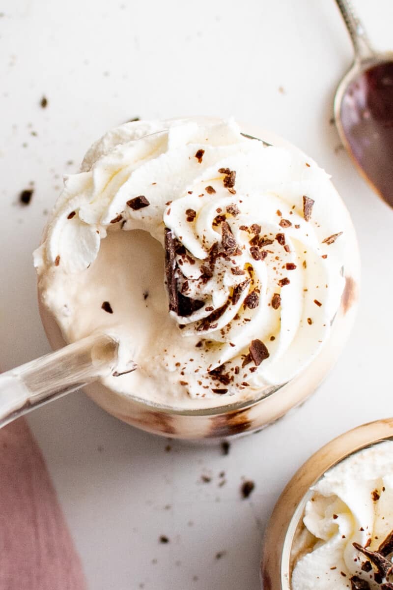 overhead view of a coffee drink topped with whipped cream and chocolate shavings