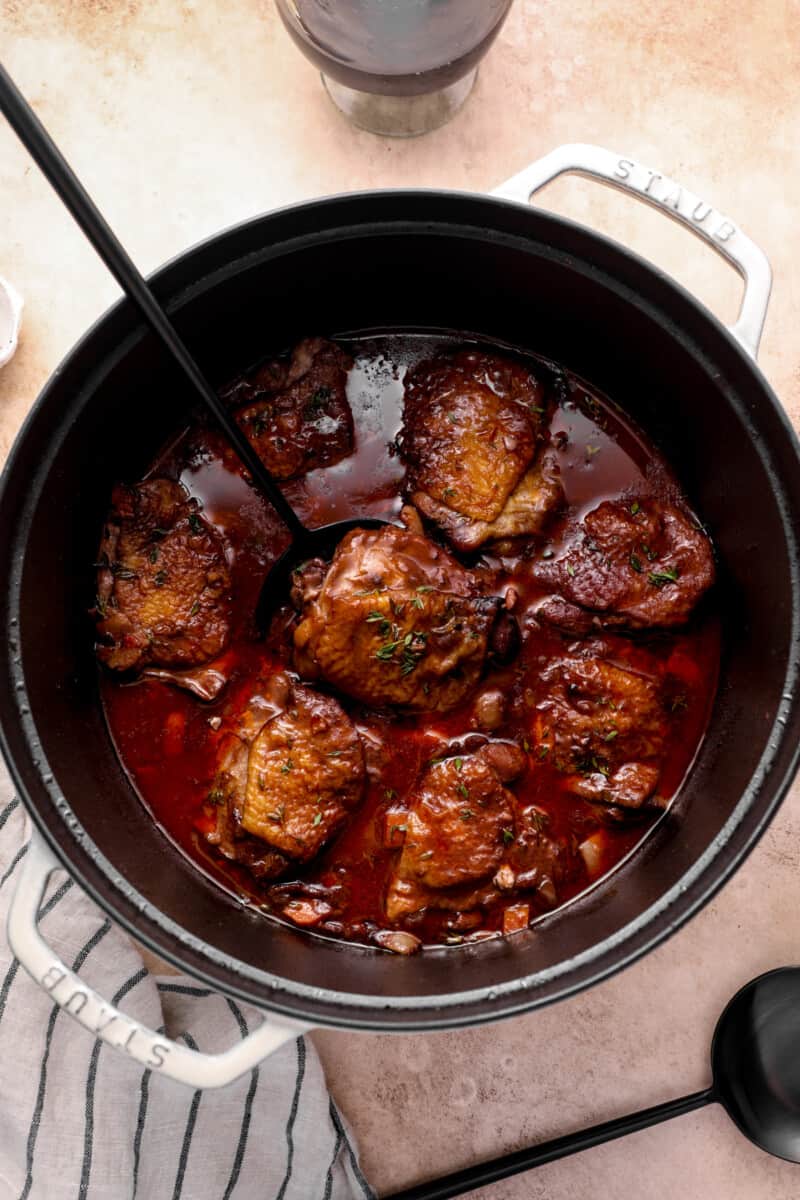overhead view of a dutch oven, filled with coq au vin
