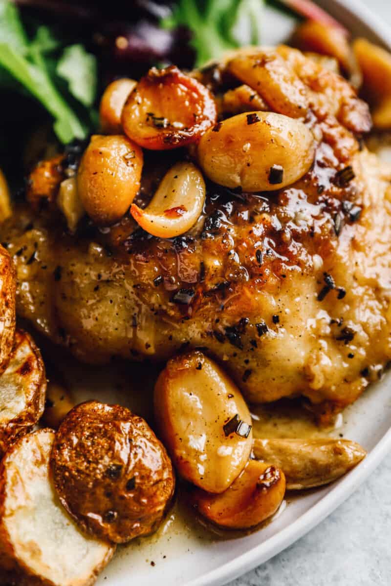 close up on chicken thighs with garlic