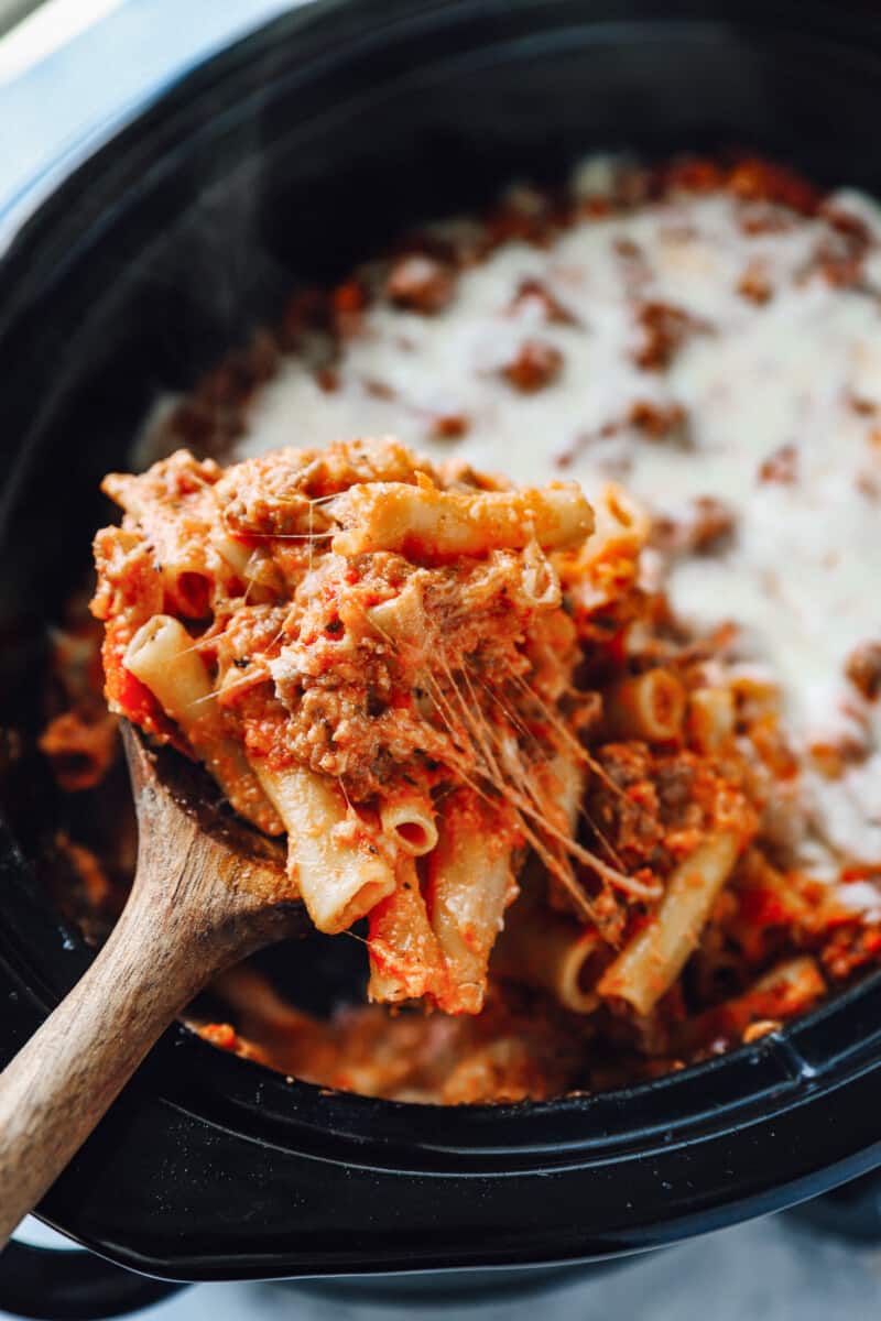 a wooden spoonful of crockpot baked ziti.