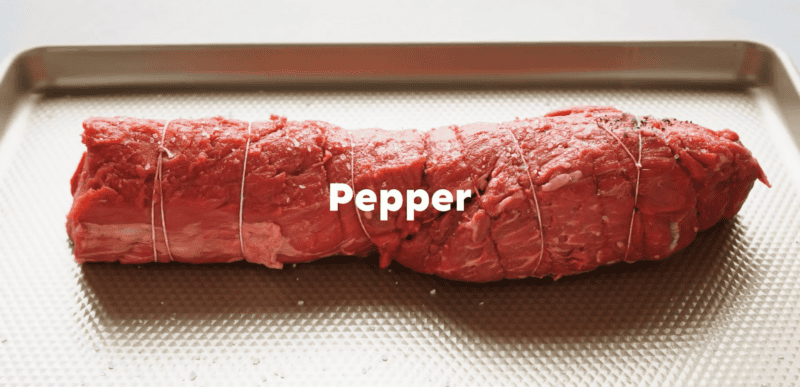Seasoned beef tenderloin with salt and pepper.