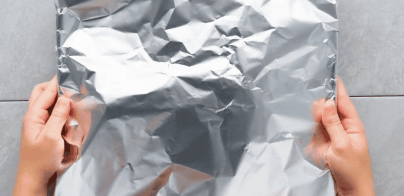 Beef tenderloin covered with foil.