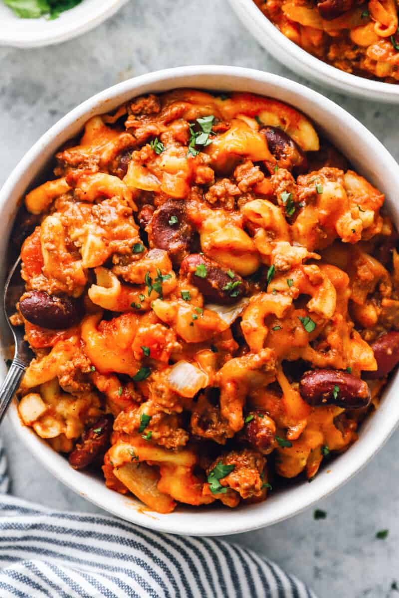 close up of crockpot chili mac in a white bowl.