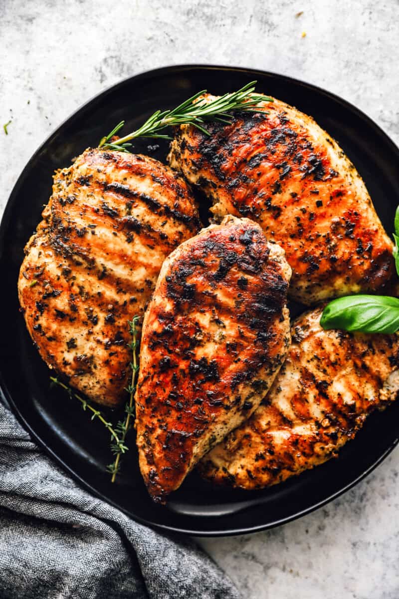 a plate of garlic herb grilled chicken breast