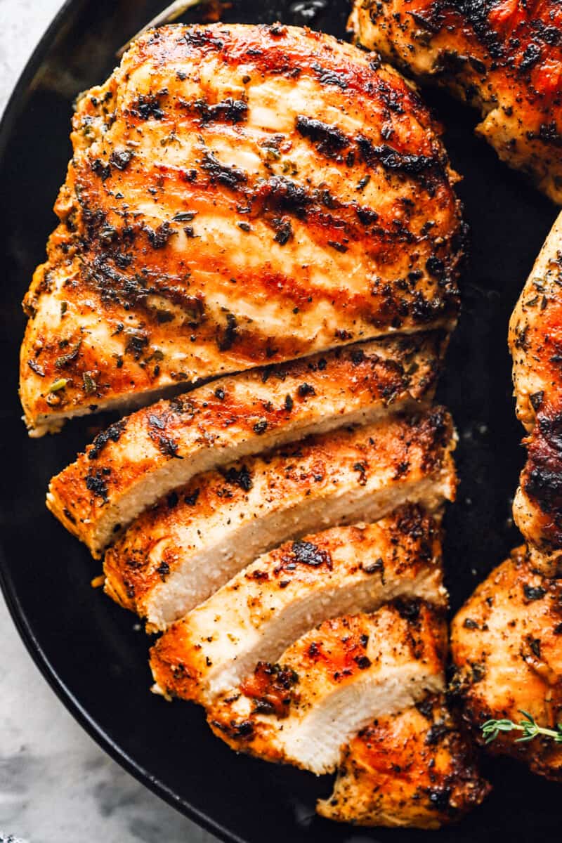 close up on sliced chicken breast that has been marinated and grilled