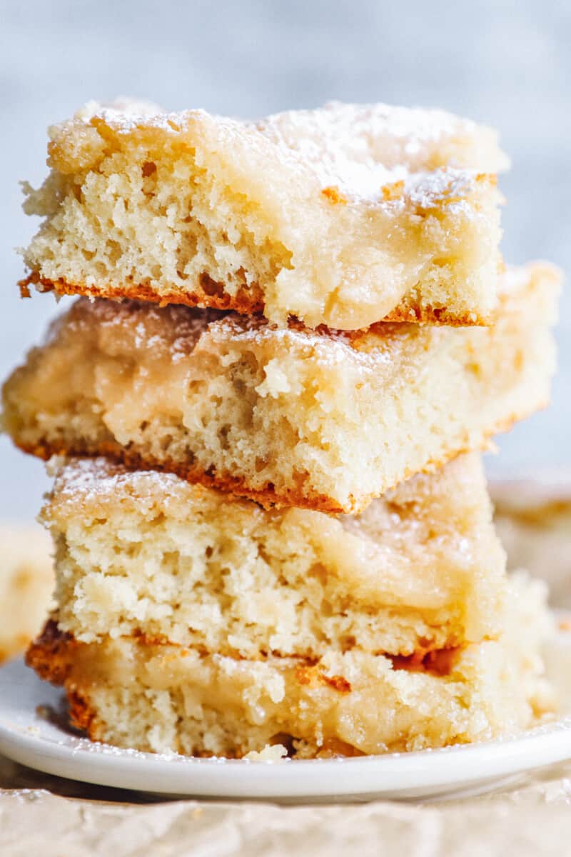 close up on a stack of ooey gooey butter cake pieces
