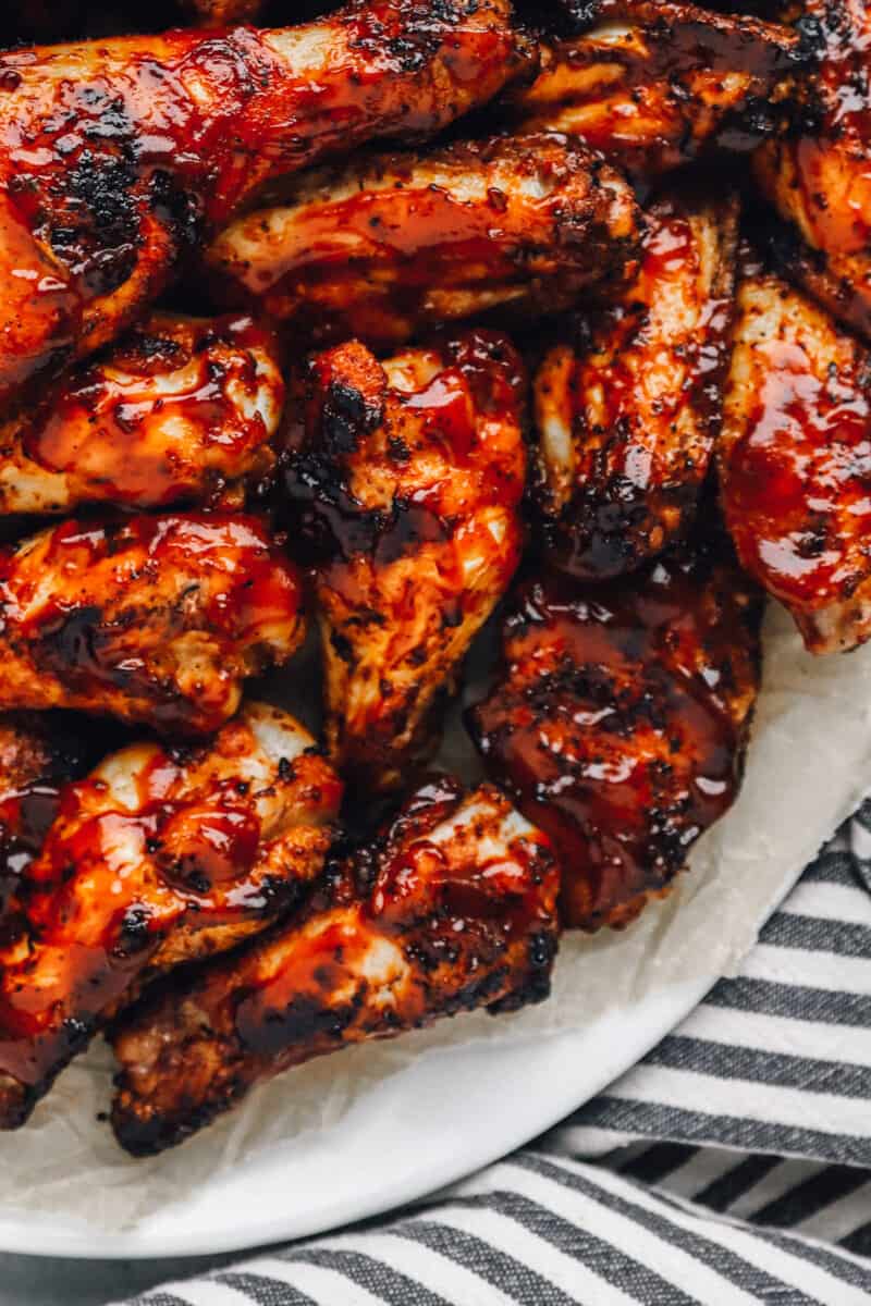 chicken legs, drumsticks, and thighs covered in BBQ sauce