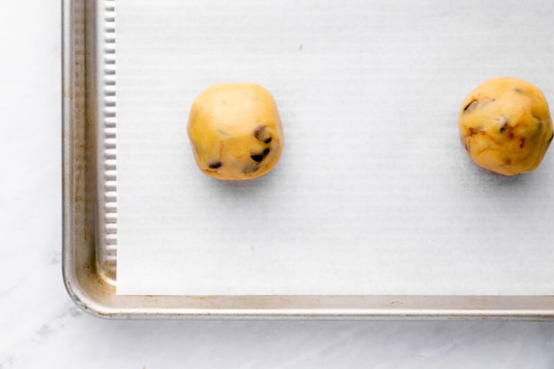 balls of cookie dough on a baking sheet