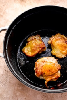 searing chicken thighs in a pot