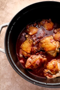 chicken cooking in wine, in a dutch oven