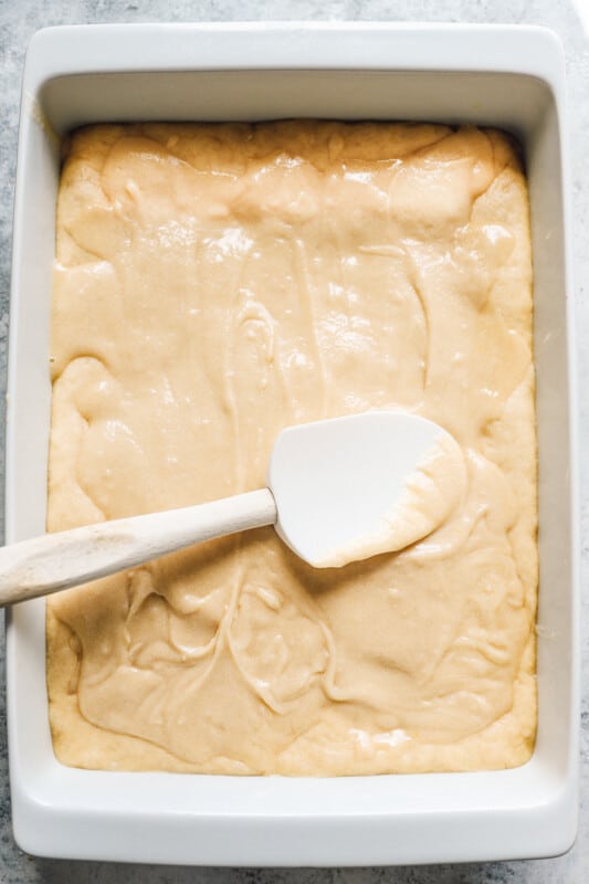 spreading and evening out cake with a rubber spatula