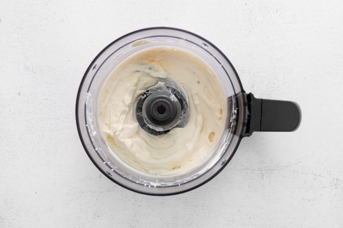 Dressing ingredients in a food processor. - 7