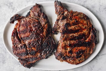 grilled ribeye steaks on a plate