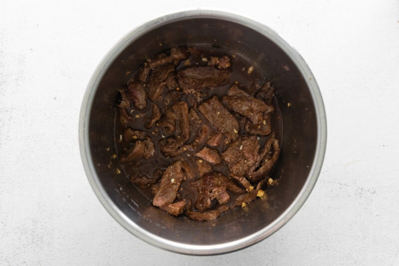 beef strips with sauce in an instant pot.