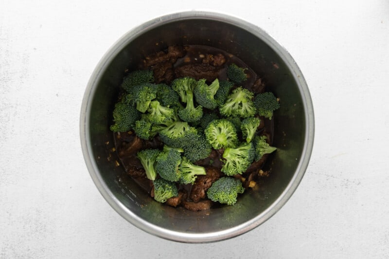 broccoli on top of mongolian beef in an instant pot.