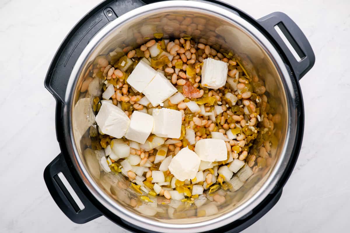 Ingredients for white chicken chili in an instant pot. - 7