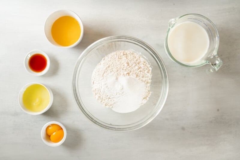 overhead view of dry ingredients for belgian waffles in a glass bowl.