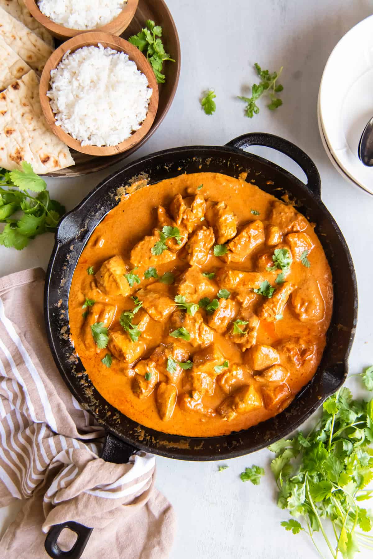 overhead view of indian butter chicken in a cast iron skillet.